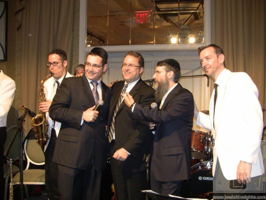 Avraham Fried, Dovid Gabay, Shloime Dachs & Meir Sherman posing for a picture at a wedding