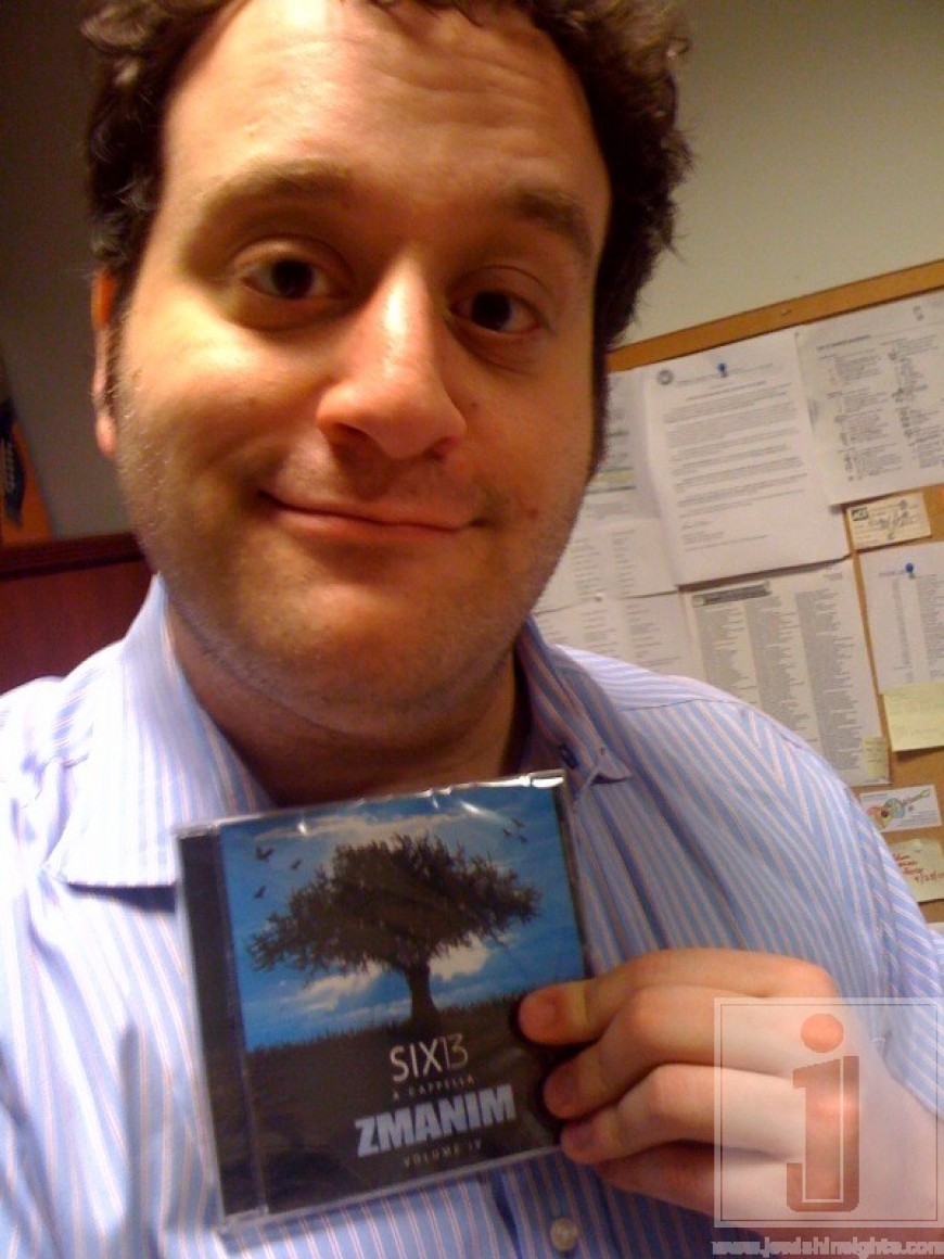 Mike Boxer holding a copy of Six13’s latest album ZMANIM